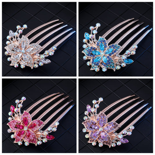 Four decorative hair combs with floral designs and gemstones on a black tiled background.