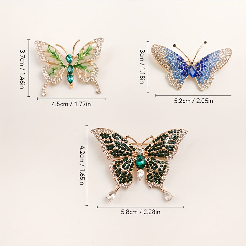 Three butterfly-shaped brooches with measurements on a white background