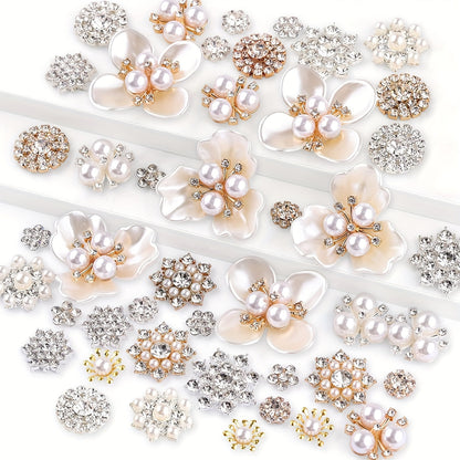 Assorted pearl and rhinestone flower embellishments on a white background