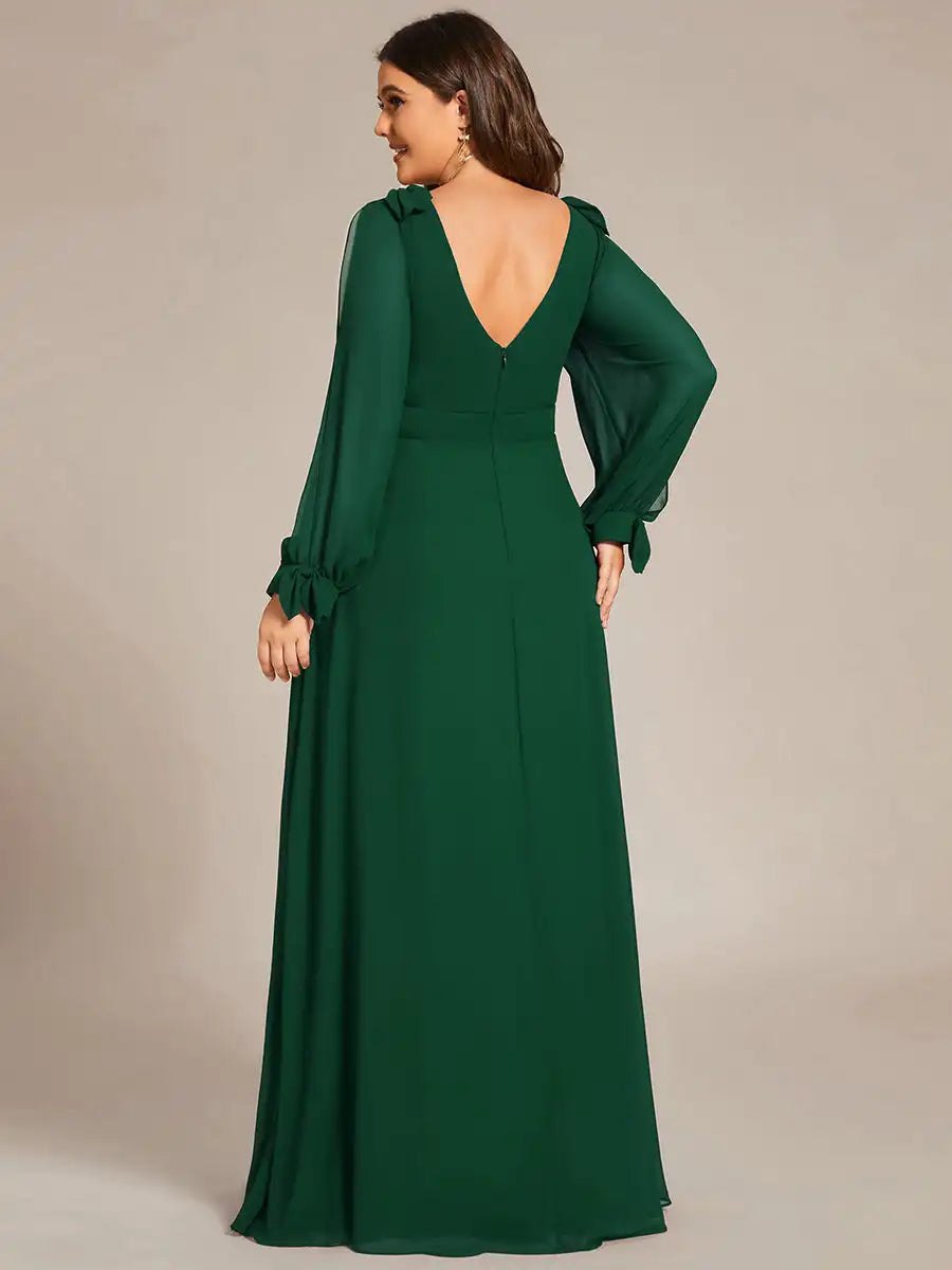Green evening gown with long sleeves on a neutral background