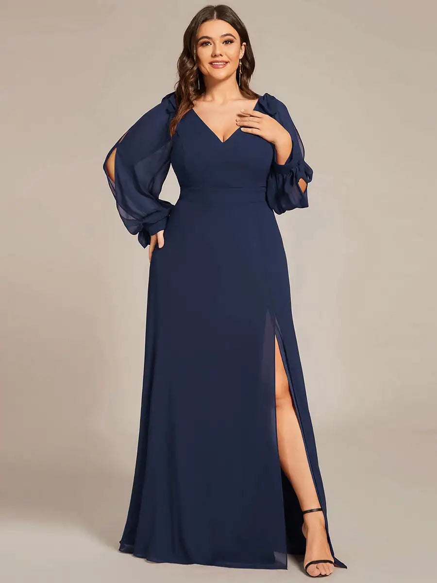 Woman wearing a navy blue evening gown with long sleeves on a beige background