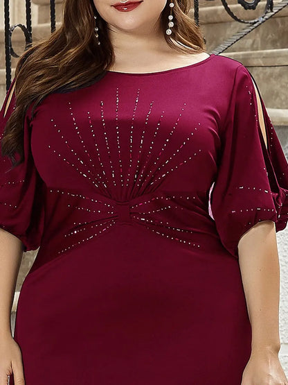 Woman wearing a burgundy dress with embellishments in an outdoor setting