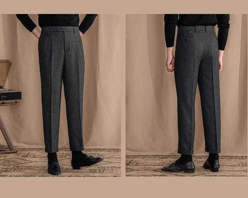 Gray trousers worn by a person on a beige background