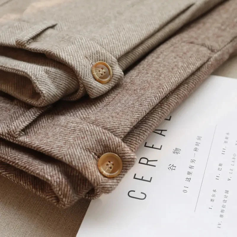 Folded beige fabric with button details on a magazine page