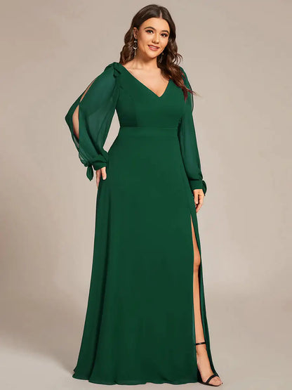 Green evening gown with long sleeves and a slit on a beige background
