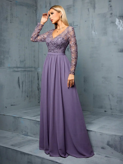 Woman wearing a long purple dress with lace detailing against a gray concrete background