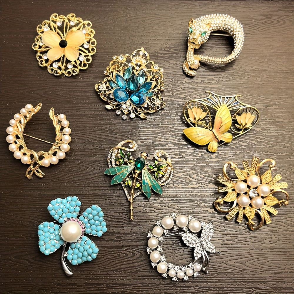 Collection of decorative brooches on a wooden surface
